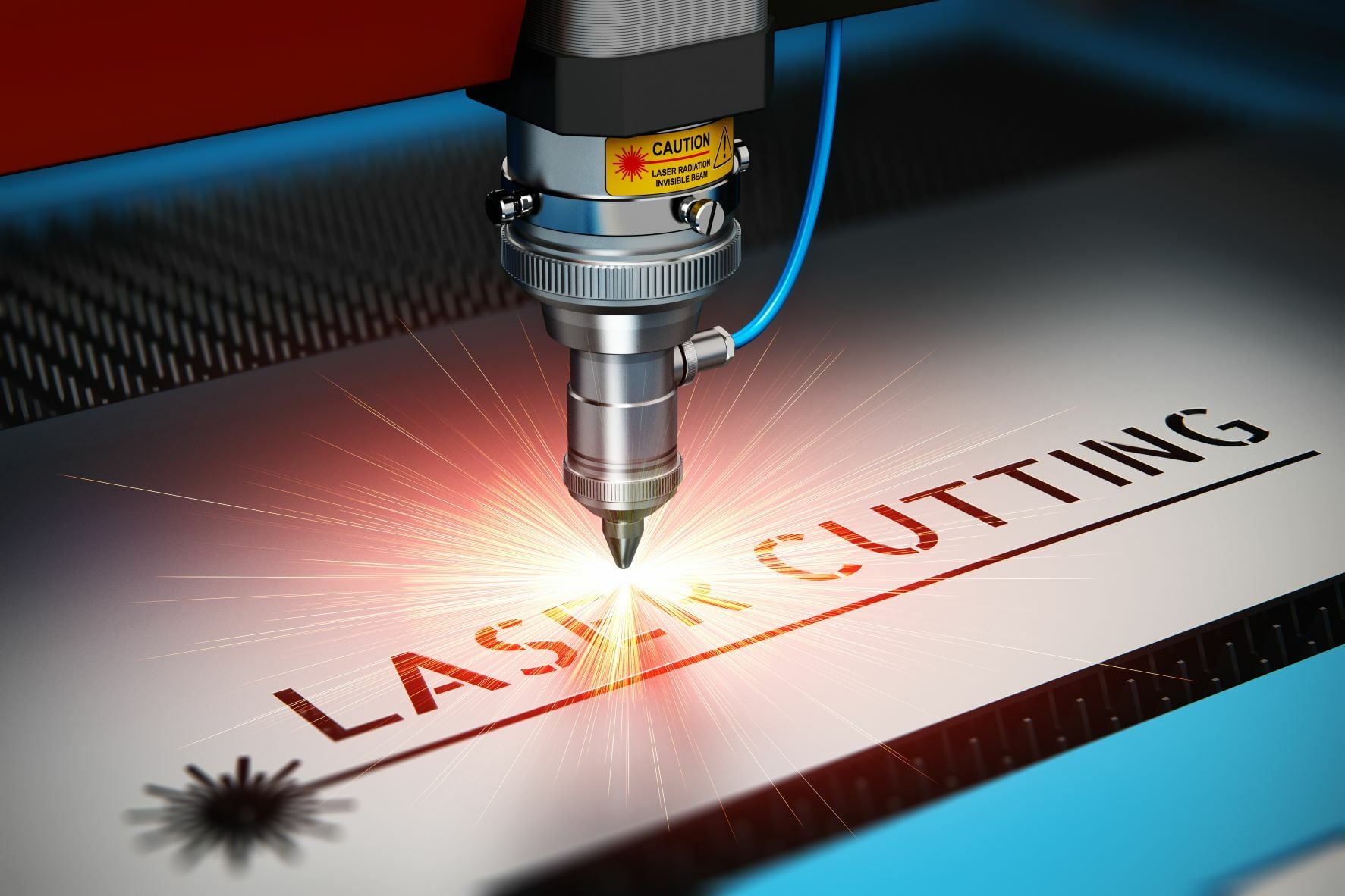 Industrial laser cutting machine slicing metal sheet with sparks