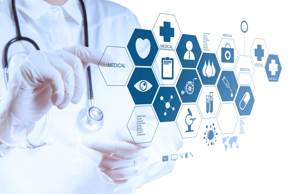 Doctor using virtual medical interface with icons