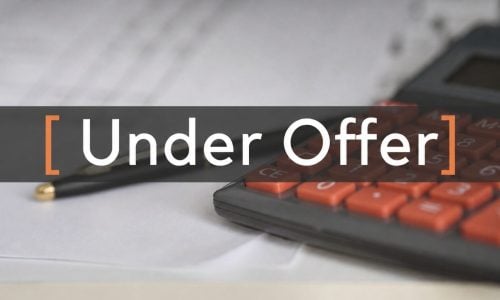 Under Offer text over calculator and pen