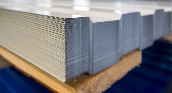 Stacks of printed paper sheets on factory table